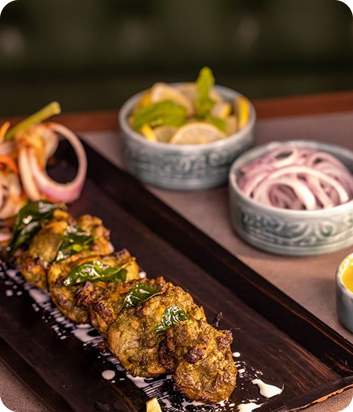 Grilled starters served on a wooden platter